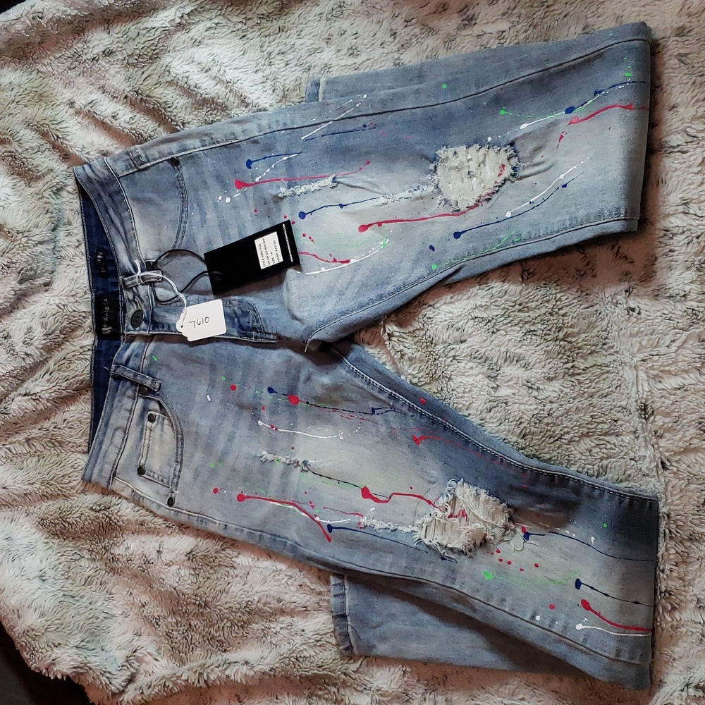 Stone washed jean with neon paint splatter, distressed knee, skinny size 14 boys